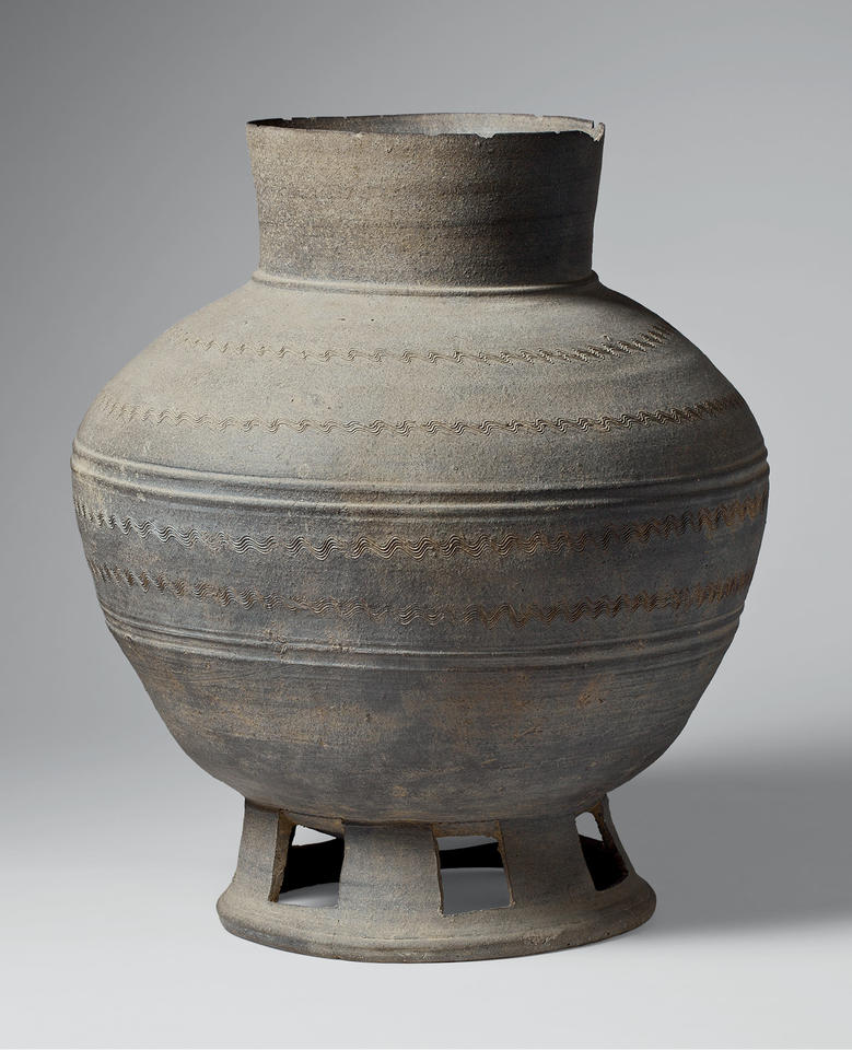 Long-necked jar with perforated base
